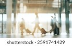 Blurred background, travel and business people in an airport with suitcase for departure on an international flight. Flare, luggage and an employee group walking in a terminal or lobby for boarding
