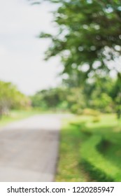 Blurred background :Blurred trees with bokeh in park background.Fresh healthy green bio background with abstract blurred foliage and bright summer sunlight .green nature concept.