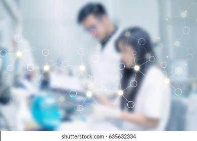 Blurred Background Two Laboratory Scientist Working At Lab With Test Tubes With Science Abstract Graphic Foreground.