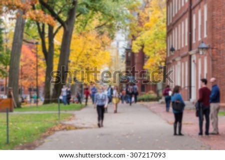 Blurred background of a university campus on a beautiful Fall day.