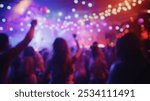 Blurred background of a vibrant crowd enjoys a lively festival atmosphere, dancing and celebrating under dazzling lights. the scene captures the joy and energy of a memorable event.