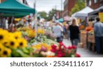 Blurred background of vibrant farmers market filled with colorful stalls displaying fresh produce and flowers, creating a lively and inviting atmosphere for shoppers.