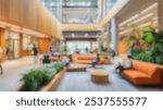 Blurred background of a vibrant university hall showcasing natural wood finishes and an inviting atmosphere. the space features comfortable seating and lush greenery, perfect for relaxation and study.