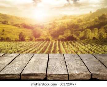 Blurred Background Of Vineyard And Brown Table 