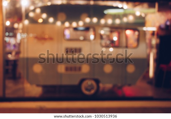 Blurred background of a vintage house with wheels\
with lights