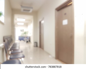 Blurred Background Waiting Room In The Doctor's Office - Chairs In The Hallway And The Door To The Doctor's Office