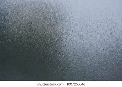 Blurred Background When See Through Car Windshield With Full Droplets