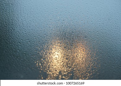 Blurred Background When See Through Car Windshield With Full Droplets