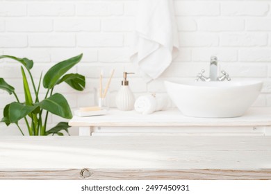 Blurred bathroom interior background with empty wooden table top for product montage