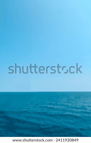 Similar – woman in red swimsuit walks by the sea. blurred