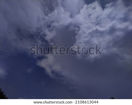 Similar – Image, Stock Photo Blood moon at total lunar eclipse, shining through trees