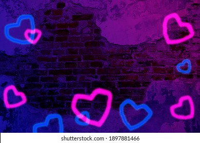 Blurred blue and pink neon hearts on old brick wall with stucco backgroud. Valentine's day concept with neon hearts, love. 14th of February. - Powered by Shutterstock