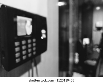 Blurred Bokeh Background Of An Office With Biometric Device