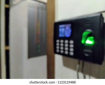 Blurred Bokeh Background Of An Office With Biometric Device