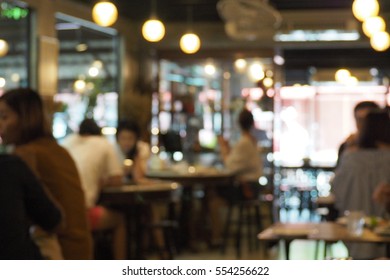 Blurred Bokeh Light Background At Restaurant With Customer Waiting For Food And Drink