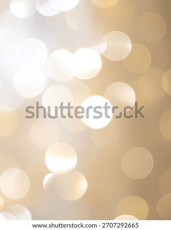 Blurred bokeh lights create a soft and dreamy glowing effect with light and golden hues.