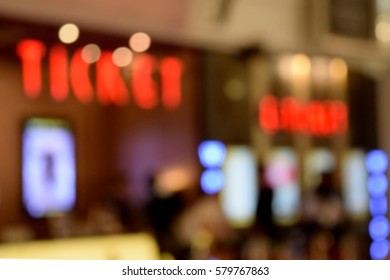 Blurred Bokeh Movie Ticket Counter At Theatre.