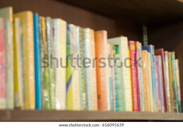Blurred books on shelf in\
Library room