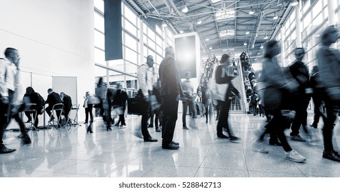 Blurred Business People At A International Trade Fair Hall