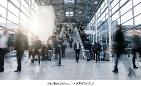 blurred business people in a modern hall - Powered by Shutterstock