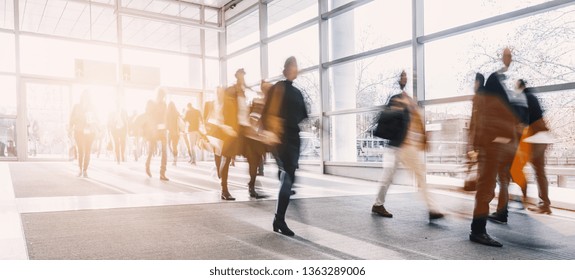blurred business people at a trade fair - Shutterstock ID 1363289006