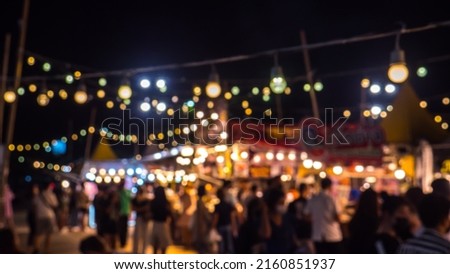 Blurred busy busy fresh market full with crowd people walking in street shopping.
Abstract blur Thailand street food outdoor garden party.