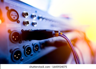 Blurred button and input jack of sound mixing console for music concert 