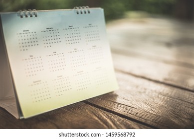 Blurred calendar in dark tone.