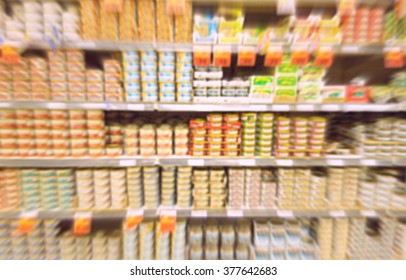 Blurred Canned Food Products At A Supermarket