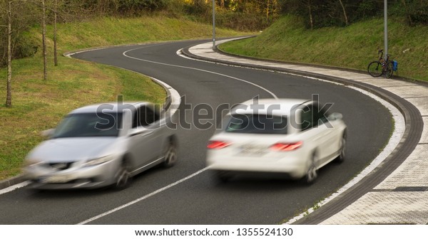 Blurred\
car driving fast on raod, city of San\
Sebastian