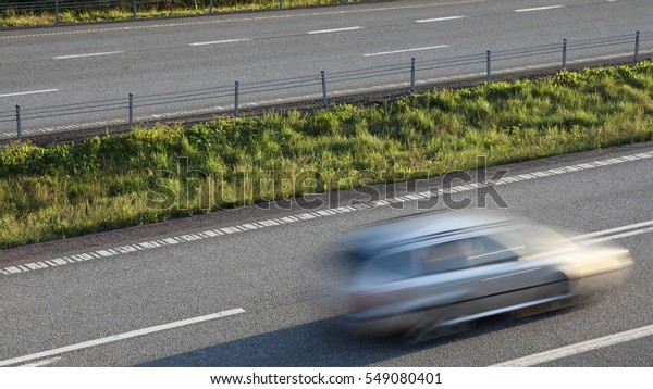 Blurred car highway\
motion. Norway freeway.