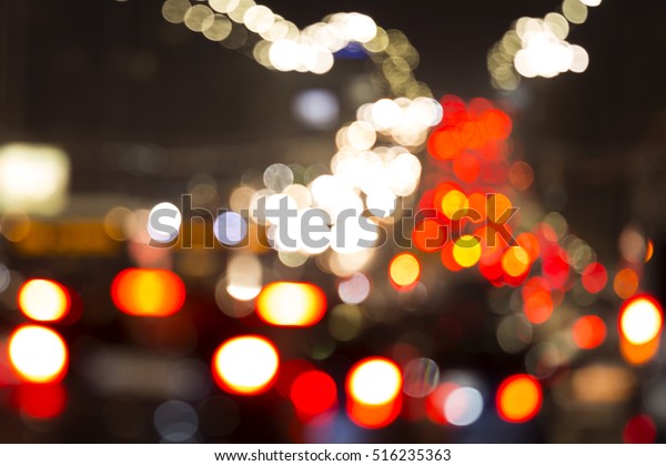 Blurred car lights. Out of focus traffic lights of\
cars on the sreet. Bokeh lights from traffic jam on night time for\
background. Beautiful background on dark, out of Focus Lights\
during the Night.