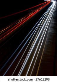 Blurred Car Lights Taken From A Motorway Bridge At Night, Slow Shutter Speed