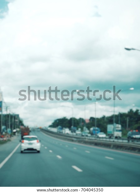 Blurred of car on\
road