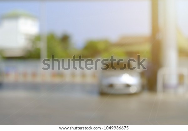 blurred car at pump gas station wallpaper\
background, transport and energy\
technology