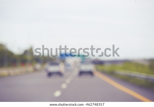 Blurred of car running on\
road