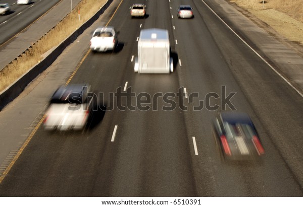 Blurred Cars on the\
interstate