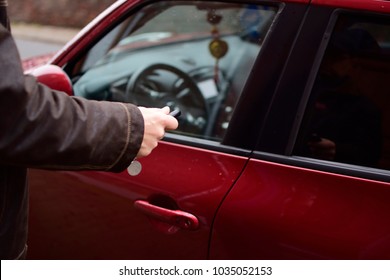 Blurred Of A Caucasian Man Closed A Car Door With Car Key Or Blur Of A Man Pressed A Remote Control For Close A Door His Car. Safety And Driving Concept. Don't Forget For Closed And Locked Your Auto. 