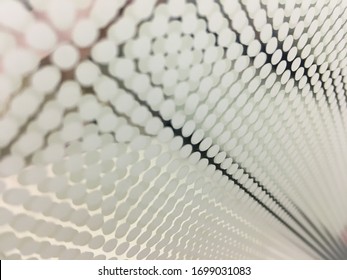 Blurred ceramic fritt glass with white dots.