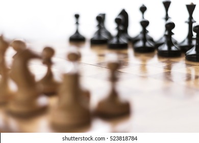 Blurred chess background. Chess set on the chess board.