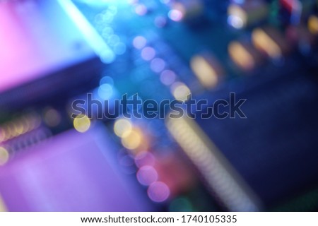 Blurred chipset, circuit board background. Bokeh abstract technology, electronic, computer.
