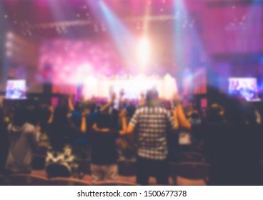 Blurred of Christian Congregation Worship God together in Big Church hall in front of music stage and light effected. - Shutterstock ID 1500677378