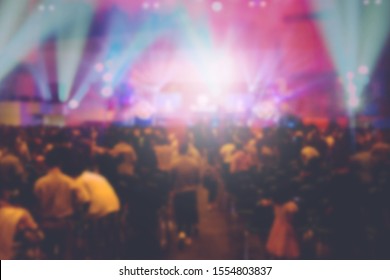 Blurred of Christian Congregation Worship God together in Big Church hall in front of music stage and light effected. - Shutterstock ID 1554803837