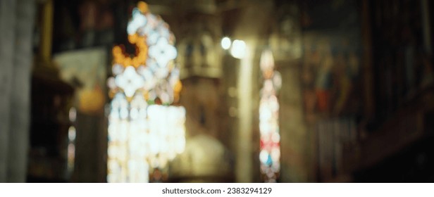 Blurred church interior with bokeh light on stained glass. Religious concept background - Powered by Shutterstock