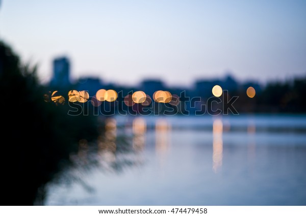 blurred
city, spot lights and cars on the evening
city