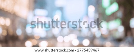 A blurred cityscape background featuring bright neon lights and soft bokeh effects, creating an energetic urban atmosphere filled with movement.