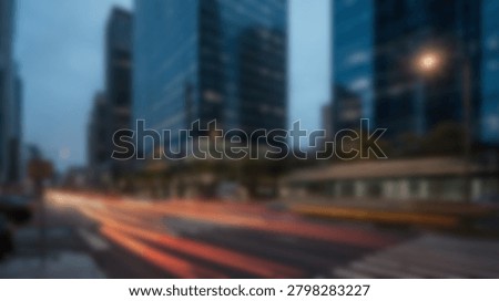 A blurred cityscape at dusk, showcasing the dynamic movement of city life and the trails of vehicle lights. This image captures the essence of urban energy.