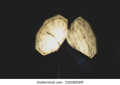 Blurred Clock At Night. Concept Of Time. Blurry Hands And Numbers On The Clock.