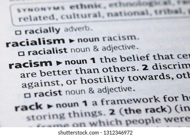 Blurred Close Up To The Dictionary Definition Of Racism