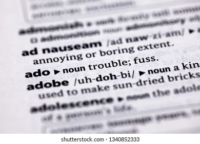 Blurred close up to the partial dictionary definition of Ado